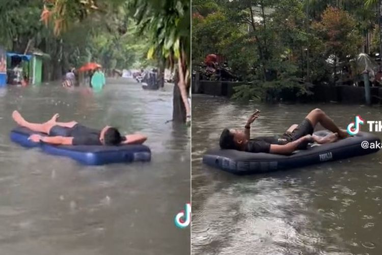 Bukannya Ngungsi, Pria Ini Malah Santai Rebahan Sambil Ngerokok di Kasur Karet pas Banjir