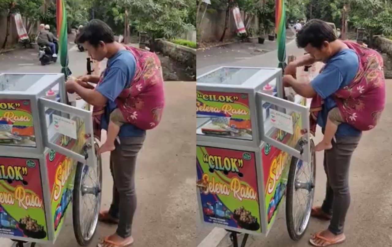 Momen Mengharukan: Pedagang Cilok Berjualan Keliling Sambil Menggendong Anaknya